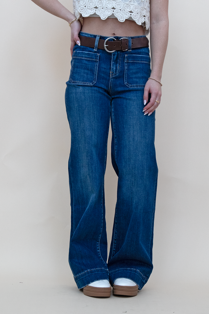 dark blue wide leg flying monkey jeans with outline pockets, styled with a white sneaker