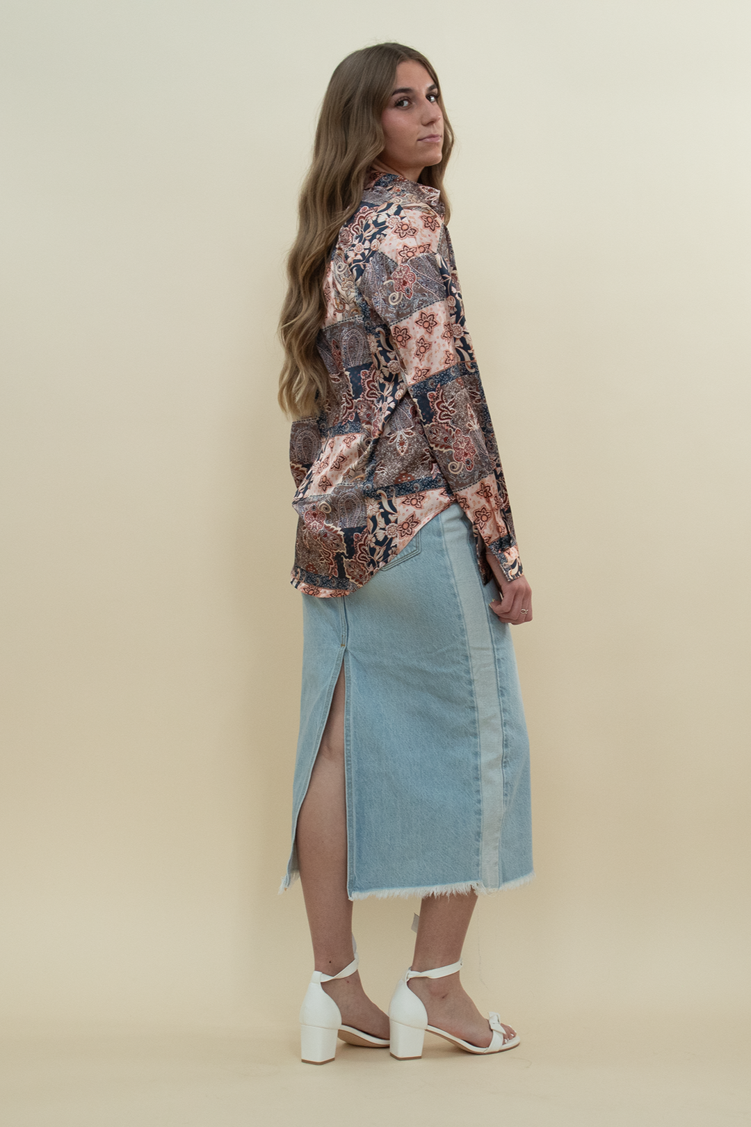 Model styled in a vintage-inspired patchwork print satin shirt with a relaxed fit and collared neckline, paired with a light wash denim skirt—eye-catching long sleeve blouse for women’s casual and boho wardrobe essentials.