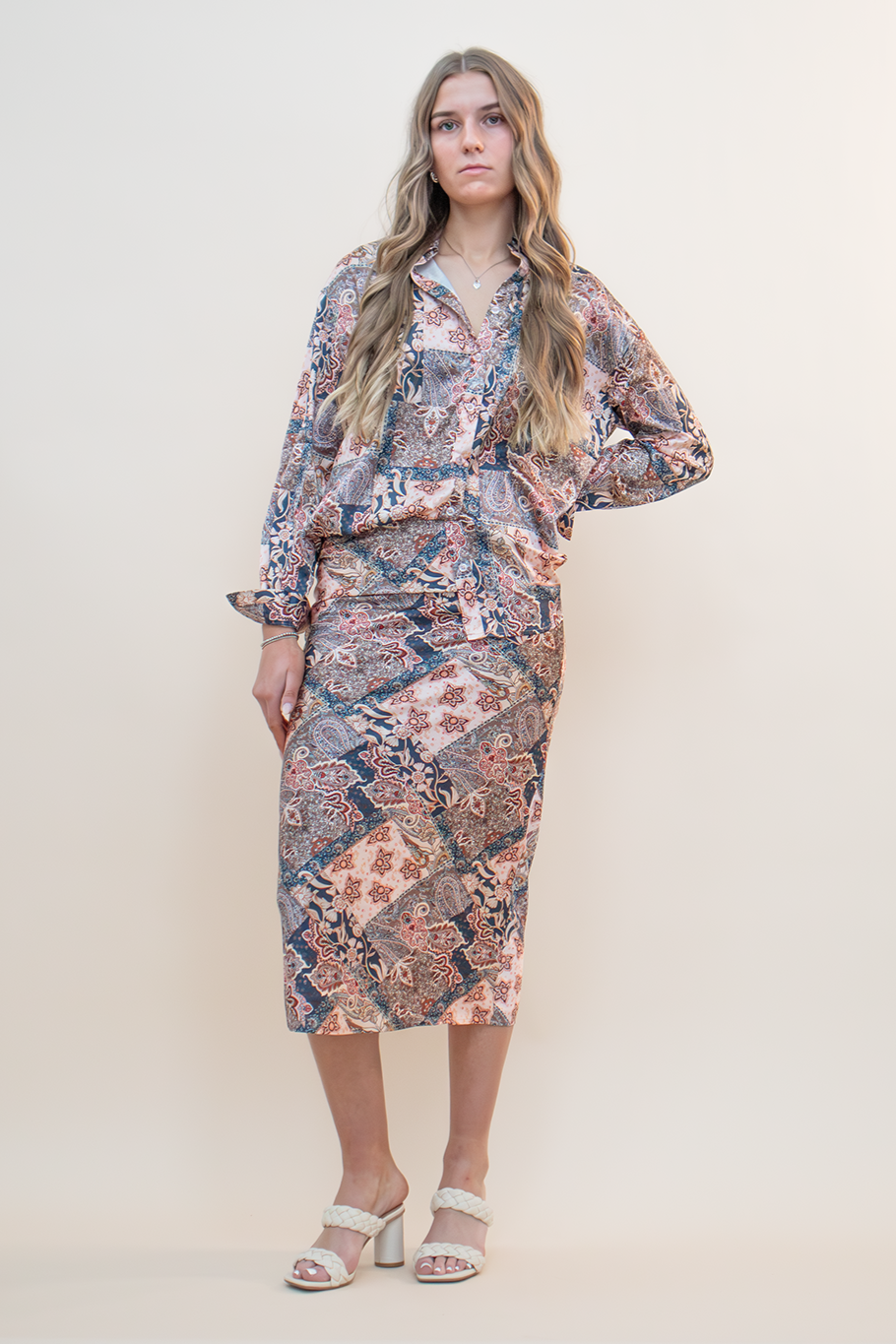 Navy Blue and light pink paisley floral patchwork button up top and skirt set styled with a nude heel